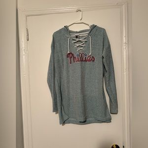 Women’s blue Phillies top with hood. Laced front with string. Size: XL